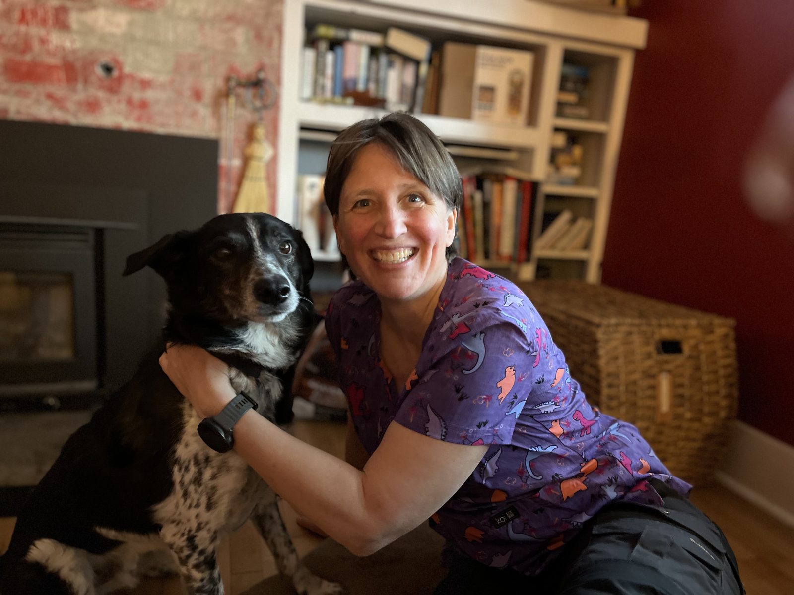 Portrait of Antje Bohm, veterinary assistant, with a dog